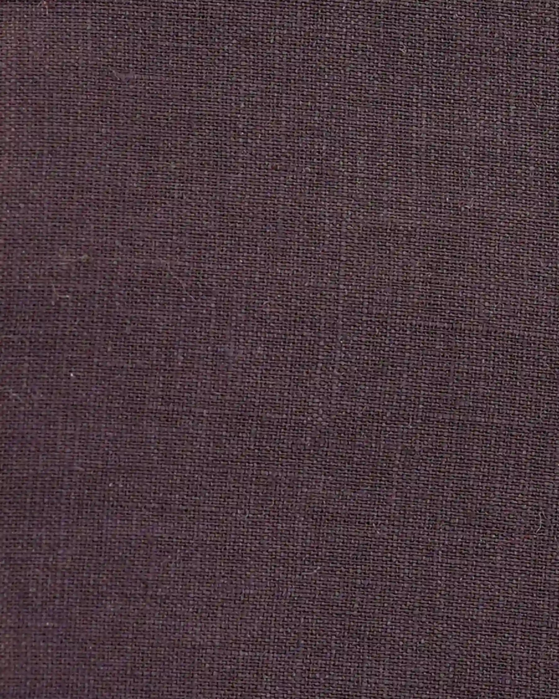 Close-up of the No.17 Full Length Linen Tea Dress in Chocolate Plum by Pyne and Smith Clothiers, featuring dark brown textured linen with a smooth, tightly knit woven pattern—perfect for a refined, subtly uniform look.