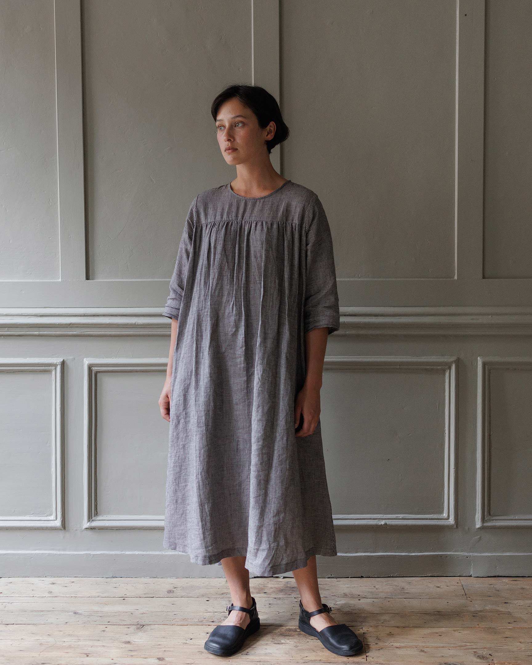 Model showing front of A line flowing linen midi dress in Hazlitt's Check without waist belt