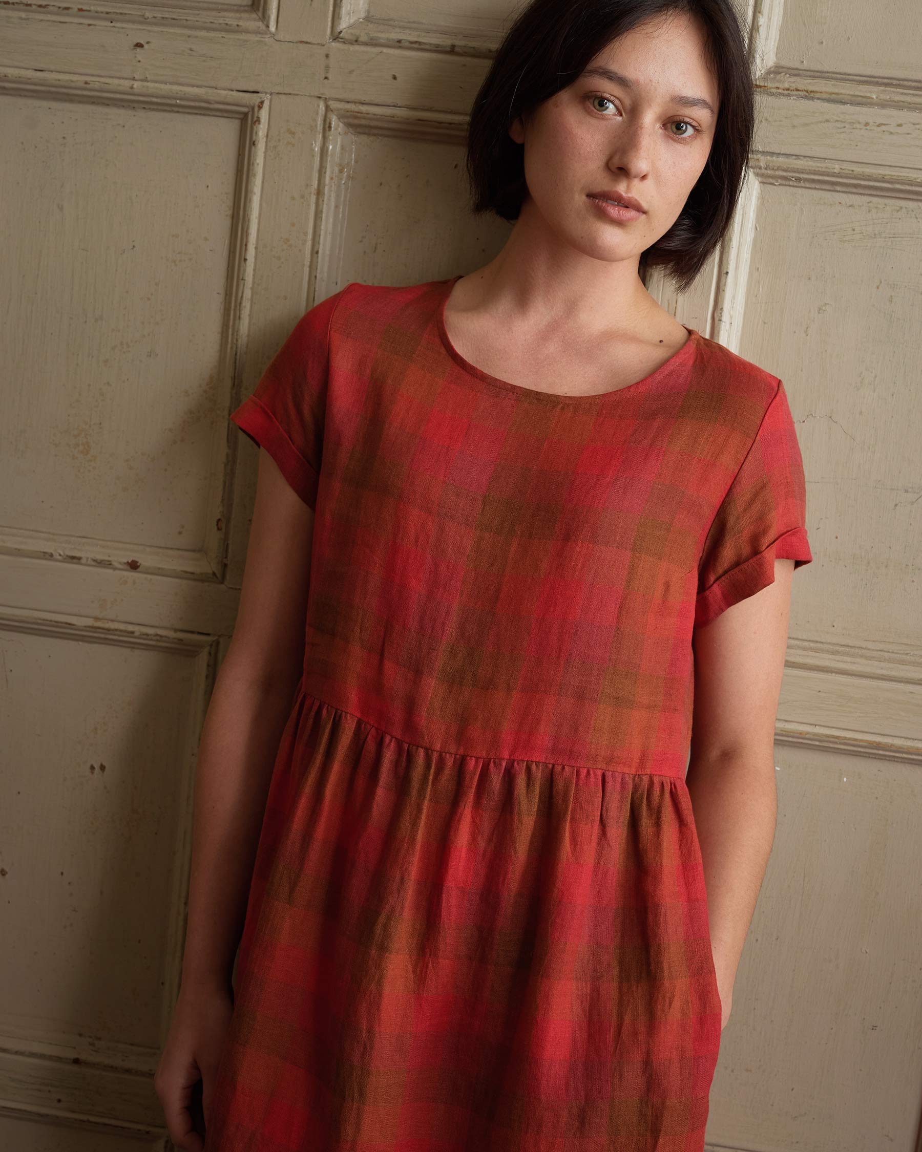 Close up of bodice on linen midi day dress in red Paloma Check