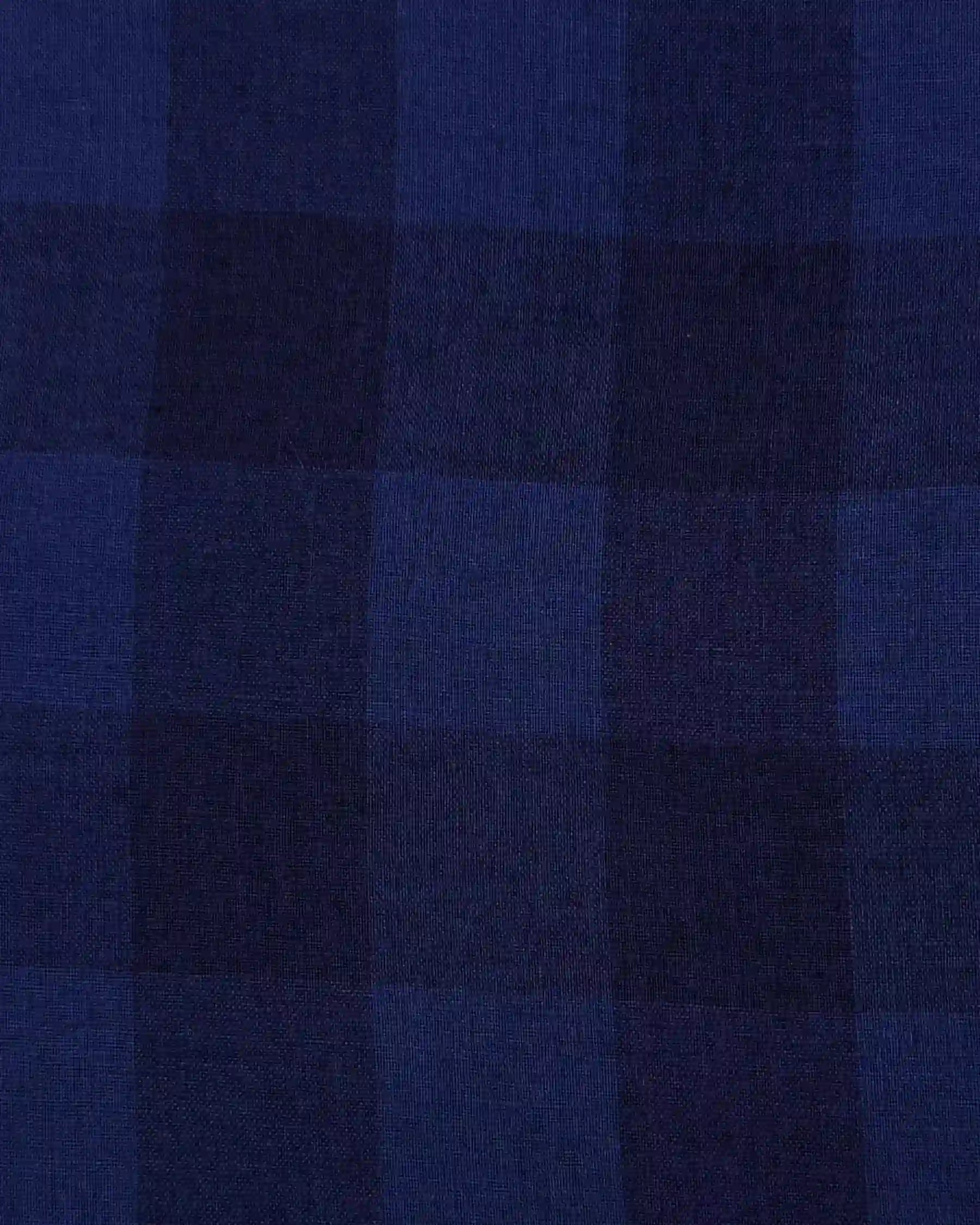 Close-up of the No.10 Button Up Linen Dress in Midsommar Night Check by Pyne and Smith Clothiers, featuring sustainable linen with a dark blue-navy large check pattern—ideal for a classic dress look.