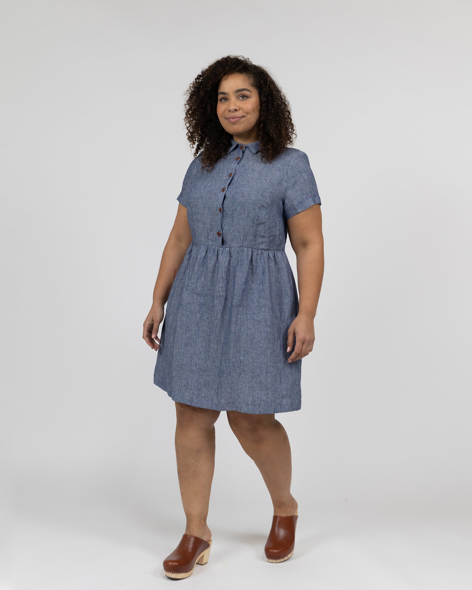 Front view of model wearing dress model number 23 in Oxford chambray linen